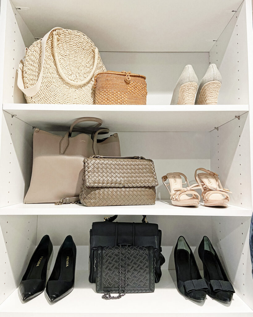 Capsule wardrobe collection of purses and shoes, organized on a closet shelf. Avoid impulse buying with curated accessories.