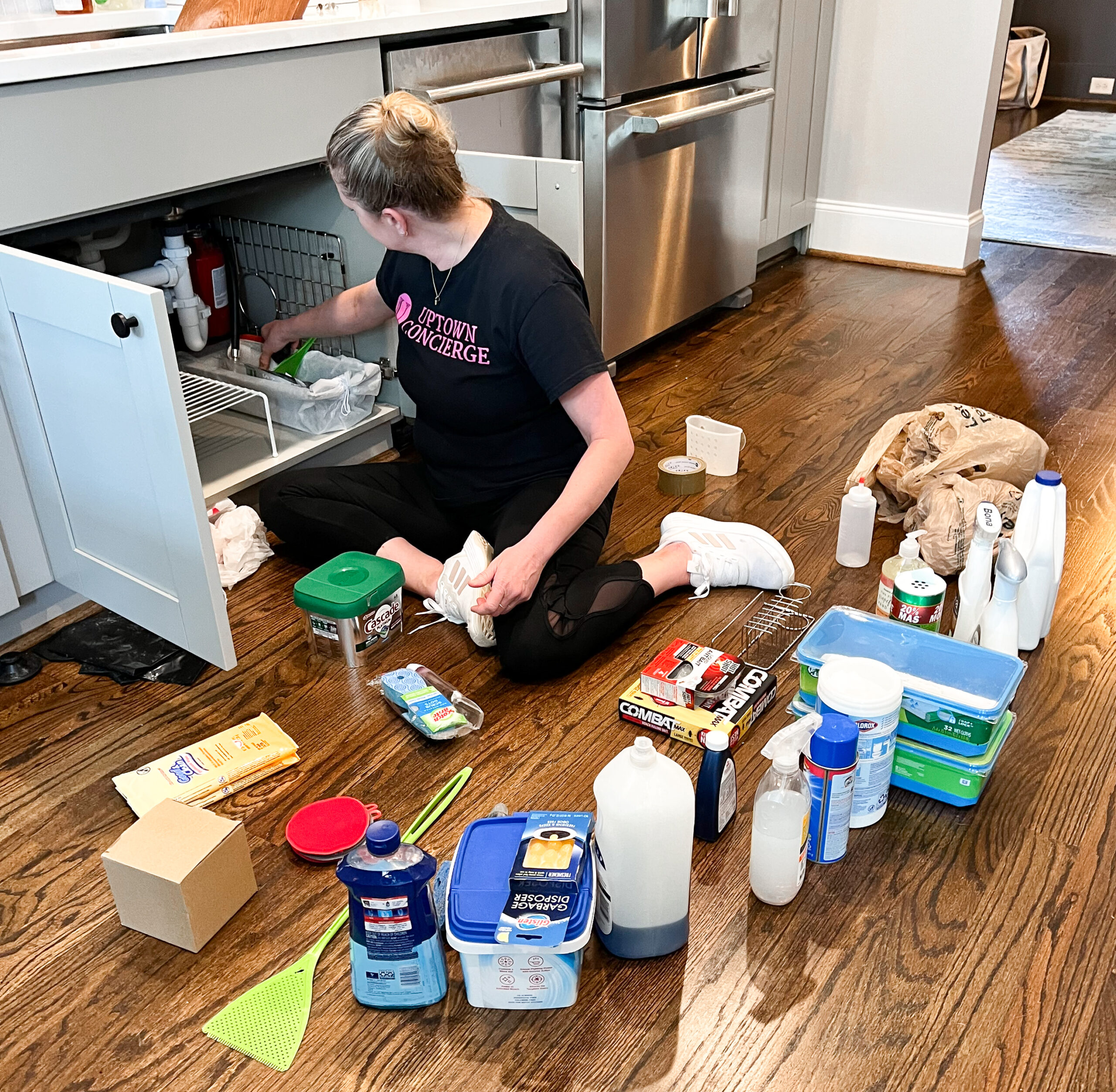 UpTown Concierge Professional Organizer decluttering under the kitchen sink