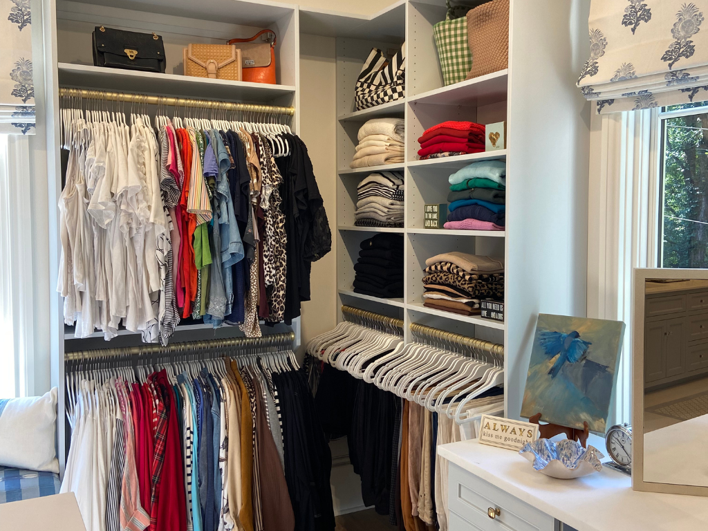 closet organized with bright and colorful clothes