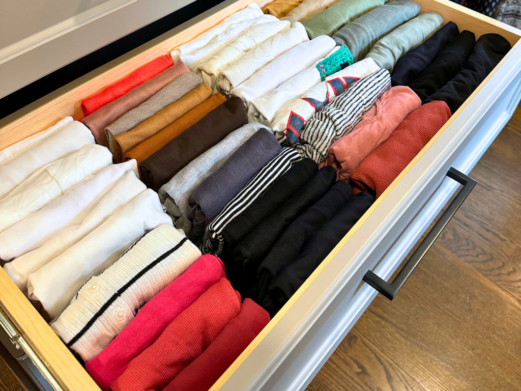 open drawer showing file folded shirts